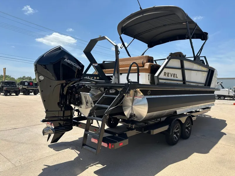 Slide: The Image of The image shows a modern pontoon boat, the Revel RL23, year 2027, with a Mercury outboard motor. - 6