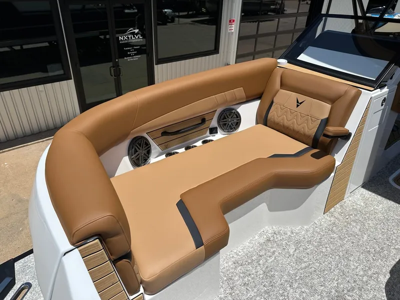 Slide: The Image of The image shows a luxurious brown leather seating area on a modern boat. - 13