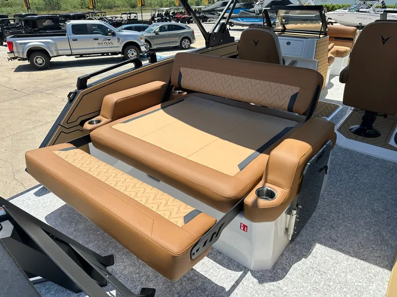 Slide: The Image of The image shows the luxurious interior of a 2027 Revel RL23 with beige leather seating. - 34