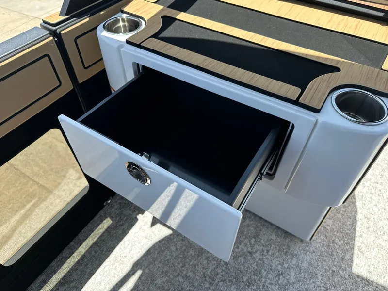 Slide: The Image of An open drawer on a modern boat with wood and metal accents. - 26
