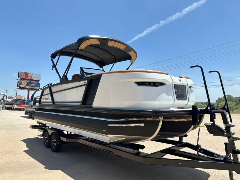 Slide: The Image of The image shows a modern boat on a trailer. It features a sleek design and a protective canopy. - 8