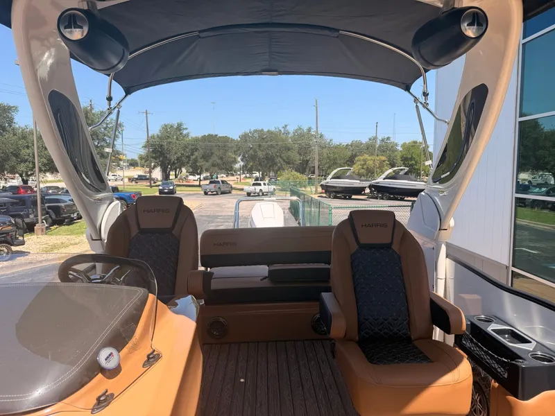 Slide: The Image of The image shows the interior of a 2027 Harris Grand Mariner 250 with luxurious seating and sleek design. - 15
