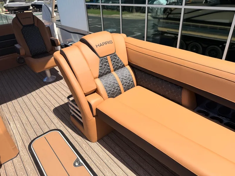 Slide: The Image of The image shows the luxurious interior of a Harris Grand Mariner 250 with elegant, upholstered seating. - 13