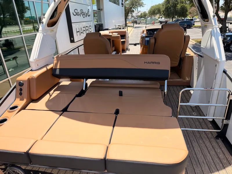 Slide: The Image of The image shows the deck of a 2027 Harris Grand Mariner 250 with brown upholstery. - 9