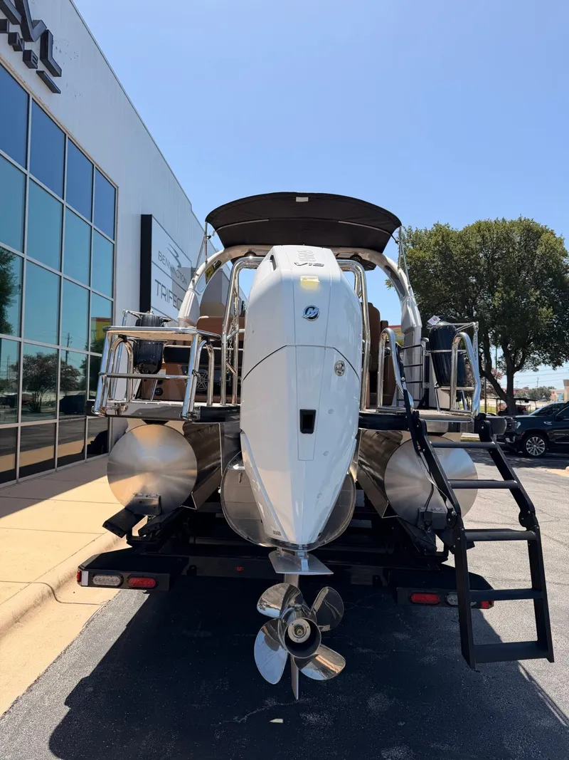 Slide: The Image of A 2027 Harris Grand Mariner 250 on a trailer. The outboard motor is visible. - 5