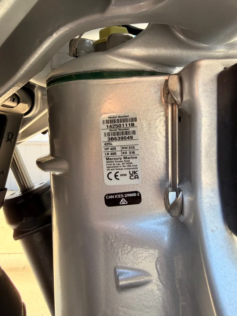Slide: The Image of Close-up of a Mercury Marine engine with serial number and technical details. - 26