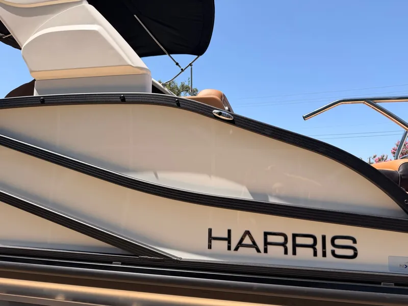 Slide: The Image of Side view of a Harris Grand Mariner 250 boat with sleek design and clean lines. - 4