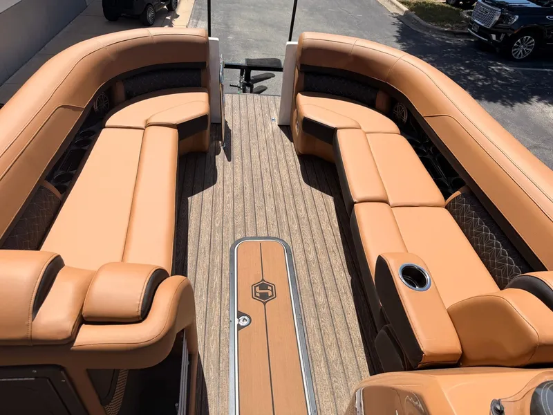 Slide: The Image of The image shows the interior of a 2027 Harris Grand Mariner 250 with luxurious leather seating. - 12