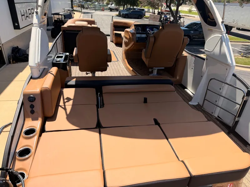 Slide: The Image of The image shows the interior of a 2027 Harris Grand Mariner 250 with brown leather seating. - 11
