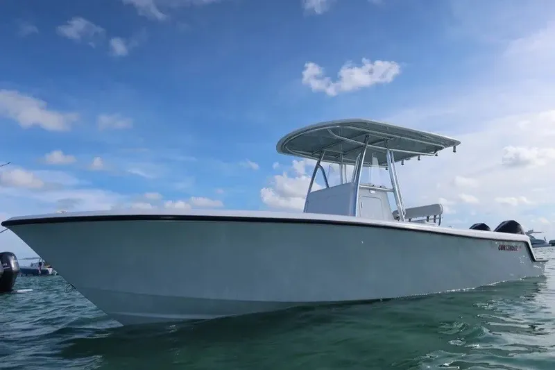 The Image of 2026 Contender 28 Tournament boat on water under blue sky. - 1