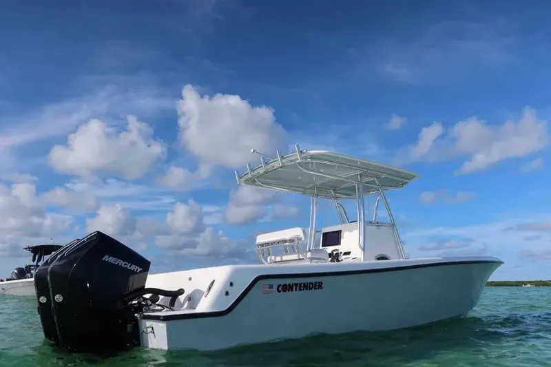 Slide: The Image of 2026 Contender 28 Tournament boat on clear water under blue sky. - 4