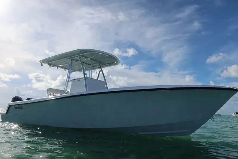 Slide: The Image of 2026 Contender 28 Tournament boat on calm ocean under blue sky. - 3