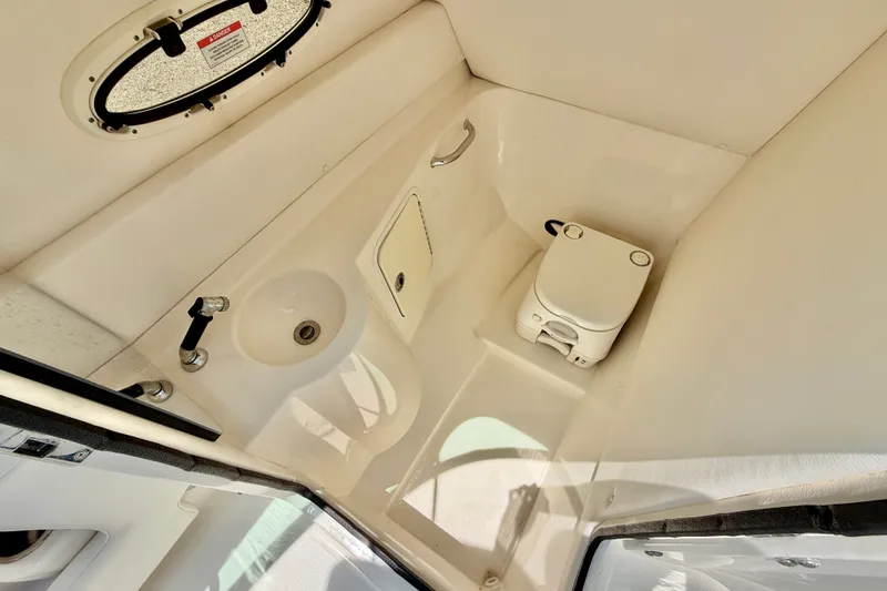 Slide: The Image of Interior of 2013 Sea Ray 260 Sundeck boat bathroom with sink and toilet. - 27
