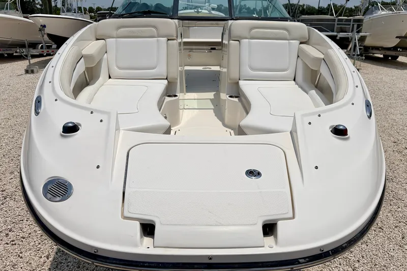 Slide: The Image of 2013 Sea Ray 260 Sundeck boat with spacious seating and sleek design. - 8