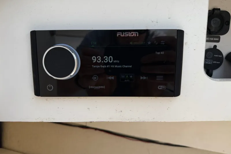 Slide: The Image of Fusion stereo system on 2013 Sea Ray 260 Sundeck, tuned to 93.30 MHz FM. - 21