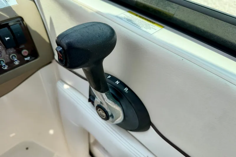 Slide: The Image of Throttle control lever on a 2013 Sea Ray 260 Sundeck boat dashboard. - 18