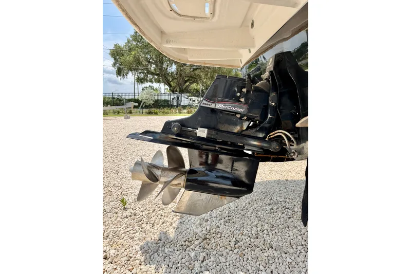 Slide: The Image of 2013 Sea Ray 260 Sundeck boat with MerCruiser outdrive, displayed on gravel surface. - 36