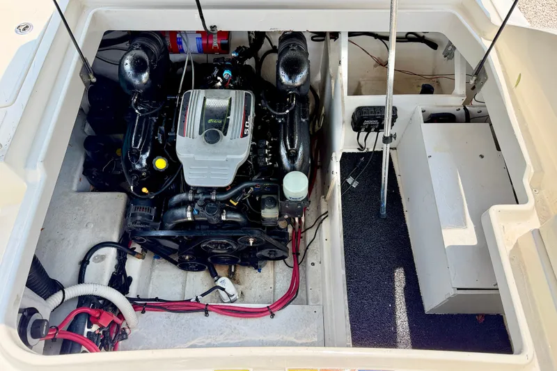 Slide: The Image of Engine compartment of a 2013 Sea Ray 260 Sundeck, showcasing a 5.0L motor. - 35