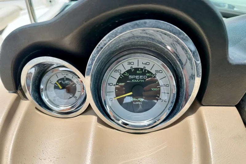 Slide: The Image of Dashboard gauges of a 2013 Sea Ray 260 Sundeck boat, showing speed and fuel levels. - 15