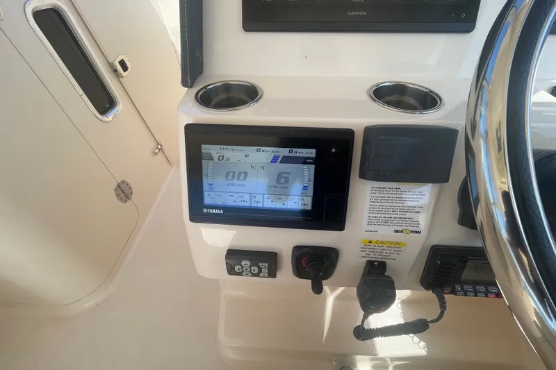 Slide: The Image of Grady-White Freedom 325 dashboard with Yamaha display and steering wheel, 2021 model. - 17