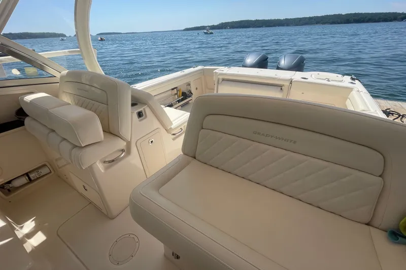 Slide: The Image of 2021 Grady-White Freedom 325 boat interior with luxurious seating and scenic water view. - 22
