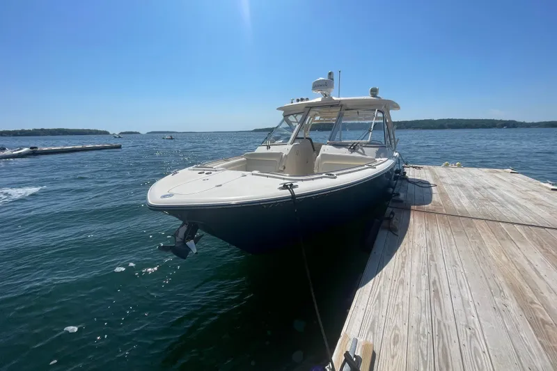 Slide: The Image of 2021 Grady-White Freedom 325 boat docked on a sunny day. - 2