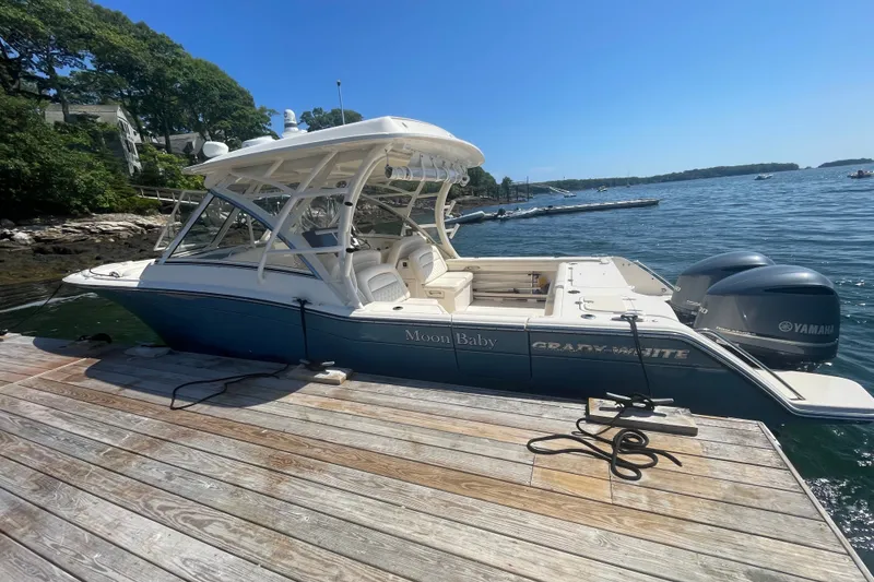 Slide: The Image of 2021 Grady-White Freedom 325 boat docked by the water on a sunny day. - 4