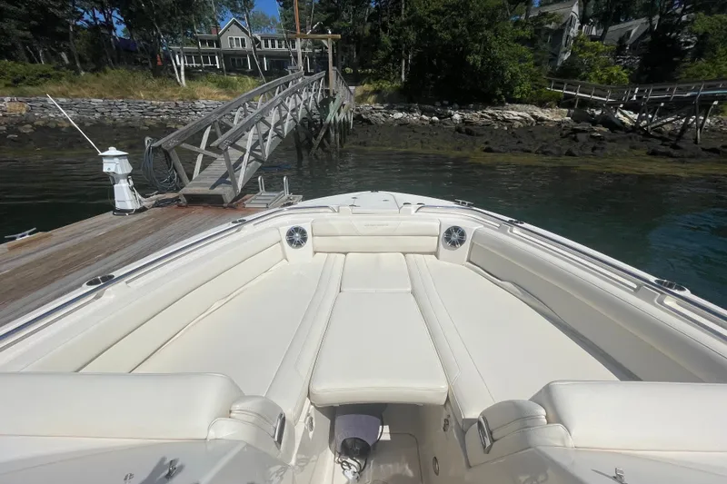 Slide: The Image of 2021 Grady-White Freedom 325 boat docked by a scenic waterfront. - 19