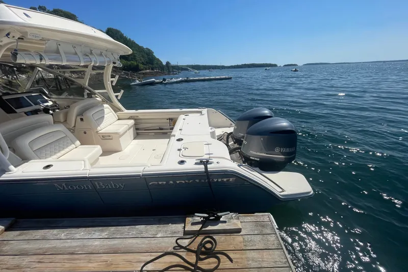 Slide: The Image of 2021 Grady-White Freedom 325 boat docked by the ocean with Yamaha engines. - 7