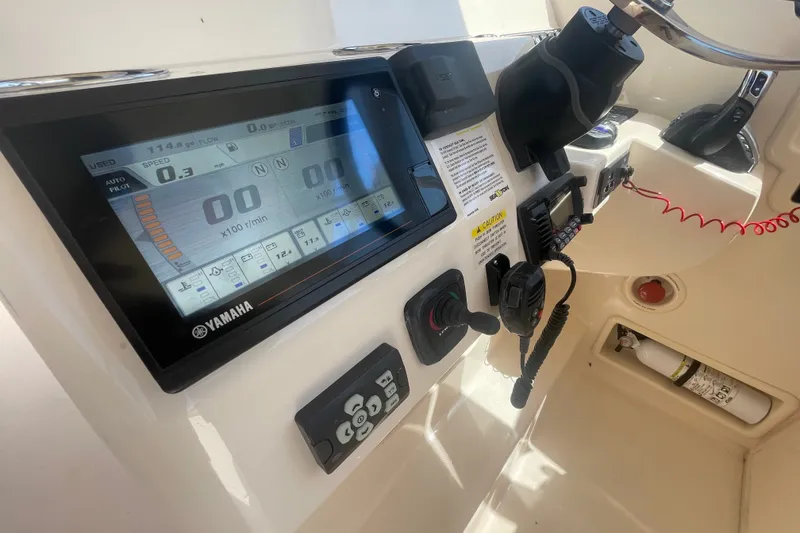 Slide: The Image of Control panel of 2021 Grady-White Freedom 325 boat with Yamaha display and controls. - 28