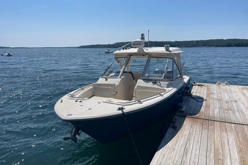 The Image of 2021 Grady-White Freedom 325 boat docked on a sunny day. - 0