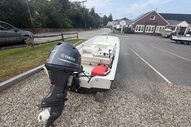 Slide: The Image of 1980 Boston Whaler Super Sport 15 with Yamaha outboard motor on gravel lot. - 4