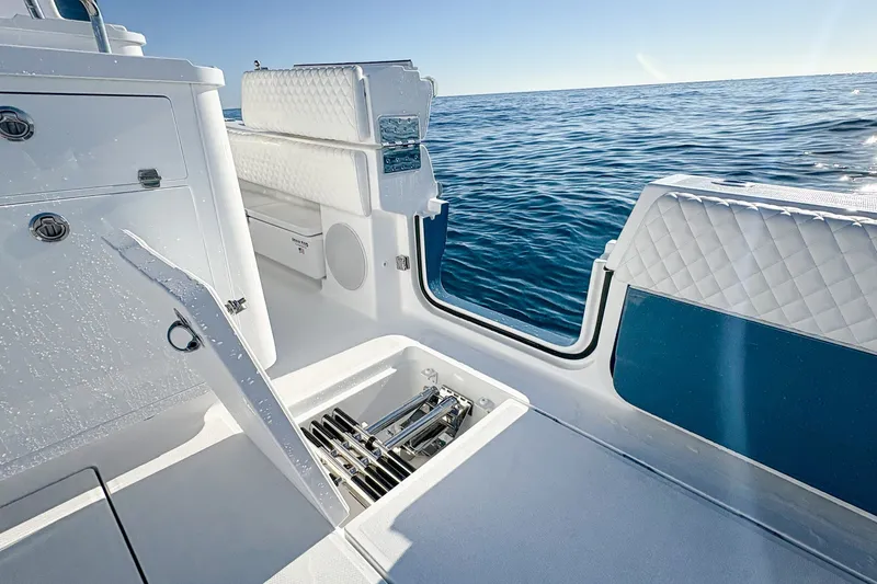 Slide: The Image of Luxurious 2027 HCB 48 Campeon boat interior with ocean view and sleek seating. - 25