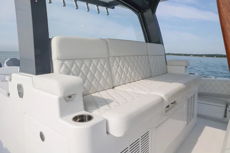 Slide: The Image of The 2027 HCB 48 Campeon features a luxurious, cushioned bench seat with a quilted design. - 10