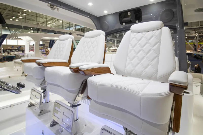 Slide: The Image of Luxurious white seating on 2026 HCB 48 Campeon boat, featuring elegant design and craftsmanship. - 15