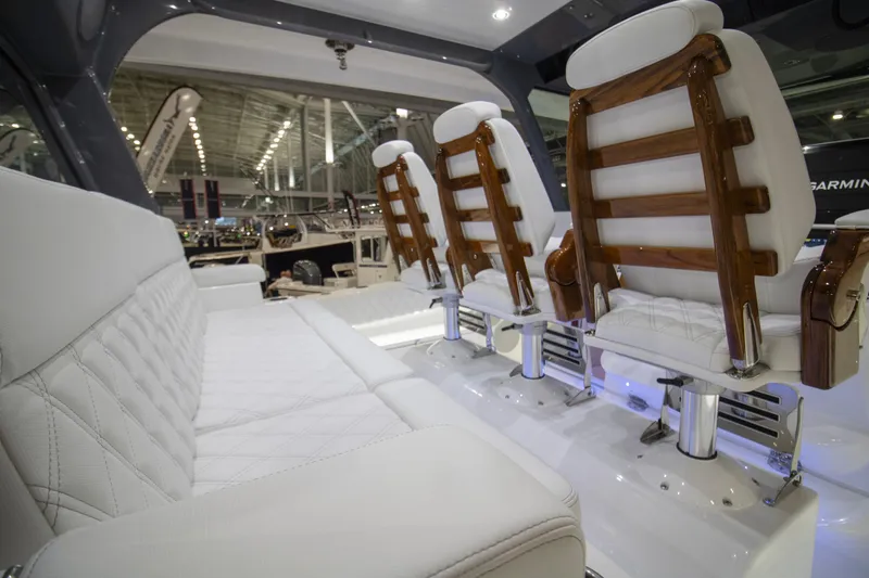 Slide: The Image of Luxurious interior of 2026 HCB 48 Campeon boat with elegant seating design. - 16