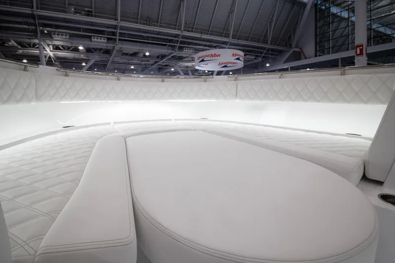 Slide: The Image of Luxurious interior of 2026 HCB 48 Campeon boat with white quilted seating. - 18