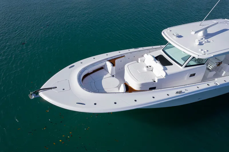 Slide: The Image of 2027 HCB 48 Campeon luxury yacht on calm blue water, aerial view. - 23