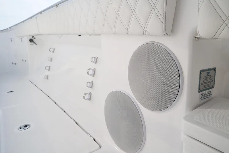 Slide: The Image of Interior of 2027 HCB 48 Campeon boat featuring speakers and quilted seating. - 11