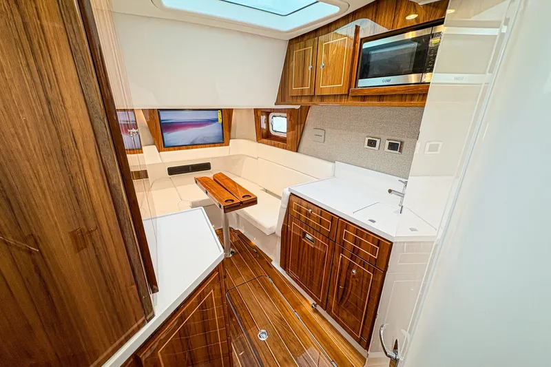 Slide: The Image of Luxurious interior of 2027 HCB 48 Campeon yacht with wood finishes and modern amenities. - 29