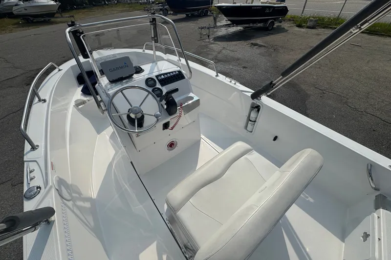 Slide: The Image of 2020 Edgewater 170CC boat interior with Garmin navigation system and steering wheel. - 12