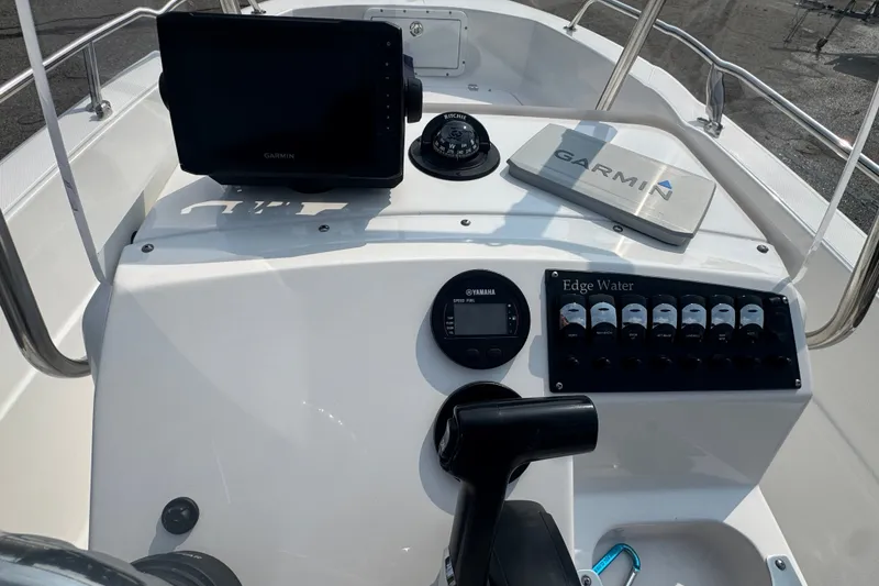 Slide: The Image of Edgewater 170CC 2020 boat dashboard with Garmin navigation and Yamaha controls. - 8