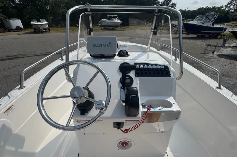 Slide: The Image of 2020 Edgewater 170CC boat console with Garmin GPS and Yamaha controls. - 11