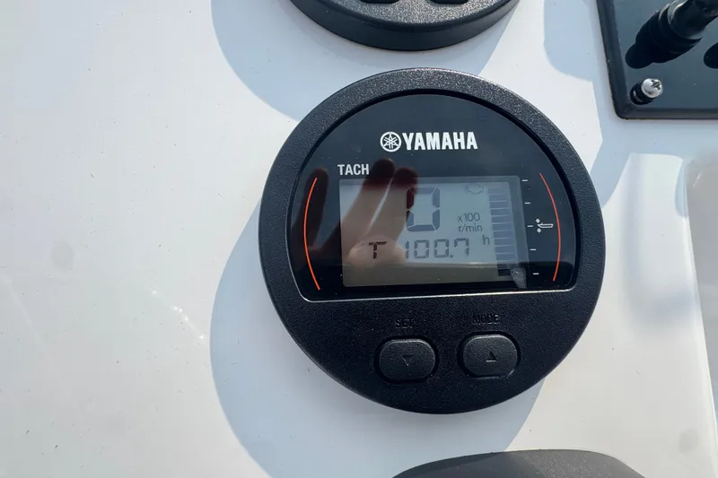 Slide: The Image of Yamaha tachometer on 2020 Edgewater 170CC boat, displaying 100.7 hours. - 13