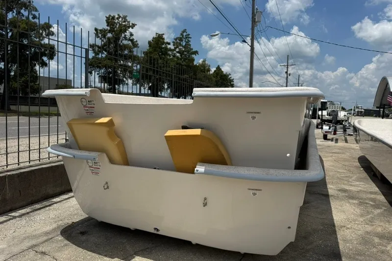 Slide: The Image of 2027 Carolina Skiff 2790 boat hull displayed outdoors under a sunny sky. - 7