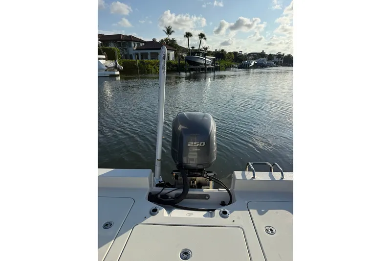 Slide: The Image of Ranger boat with 250 horsepower engine on a calm waterfront, 2015 model. - 22