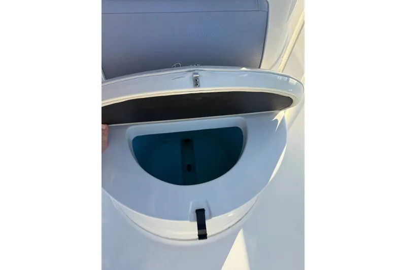 Slide: The Image of Open storage compartment on a 2015 Ranger boat, showcasing interior space. - 26