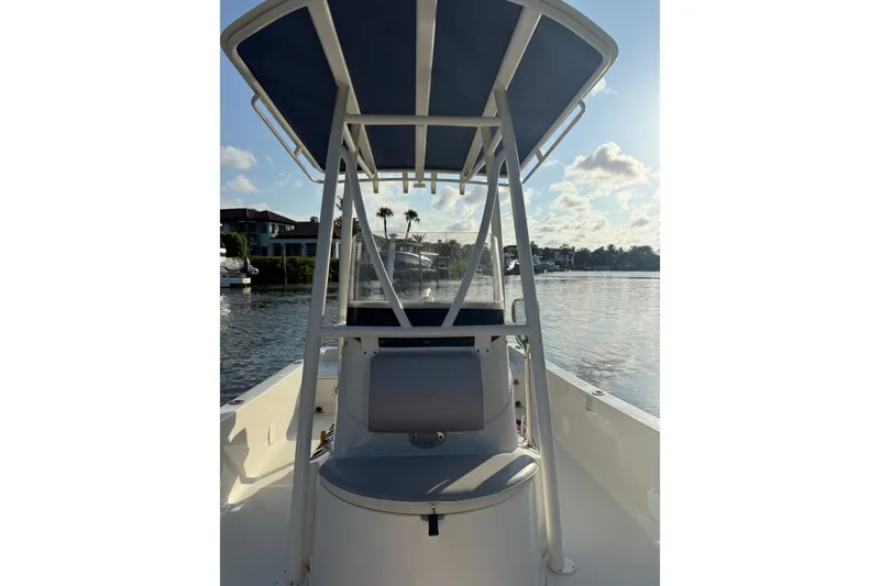 Slide: The Image of 2015 Ranger boat with T-top on calm water, sunny day. - 21