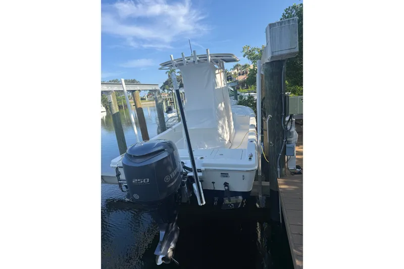 Slide: The Image of 2015 Ranger boat with Yamaha 250 engine docked by a wooden pier. - 19