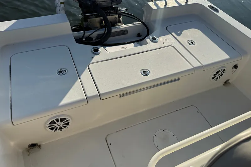 Slide: The Image of 2015 Ranger boat deck with storage compartments and speakers, under sunlight. - 25